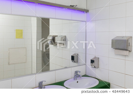 Light Toilet room in a public place Light Toilet room in a public place 48449643