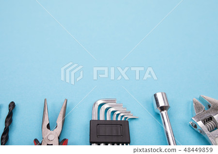 Set of different tools on blue background 48449859