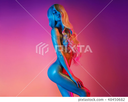 Nude sexy blonde in colorful light. Night club dance Nude sexy blonde in colorful light. Night club dance 48450682