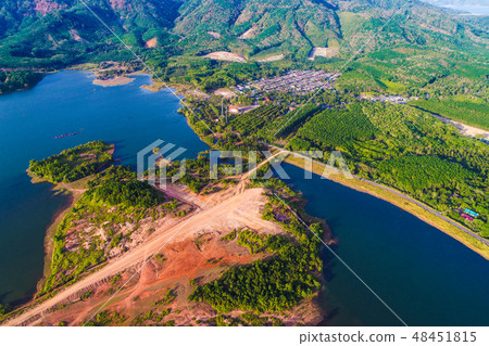 Dam with island green mountain forest blue water 48451815