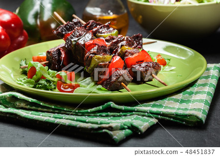 Grilled beef meat and vegetable kebabs 48451837