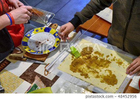 Preparation of apple strudel in the family 48452956