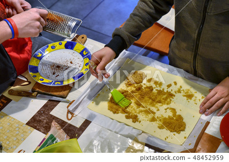 Preparation of apple strudel in the family 48452959
