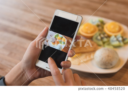 taking photo at breakfast taking photo at breakfast 48458520