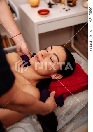 Pleasant good-looking woman relaxing with closed eyes 48458904