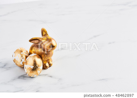 Easter greeting card, golden rabbit and eggs Easter greeting card, golden rabbit and eggs 48462897