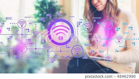 Wifi concept with woman using a laptop 48462990