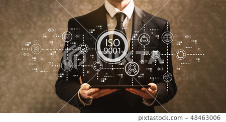 ISO 9001 with businessman holding a tablet computer ISO 9001 with businessman holding a tablet computer 48463006