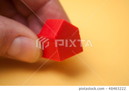 hand of man playing with plastic bricks hand of man playing with plastic bricks 48463222