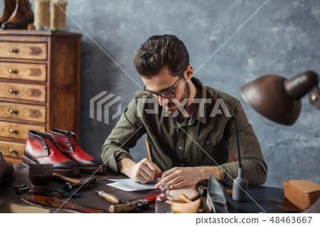 unshaven man gaining knowledge and experience in shoe industry unshaven man gaining knowledge and experience in shoe industry 48463667