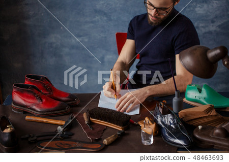 attractive shoemaker making corrections in the draft attractive shoemaker making corrections in the draft 48463693