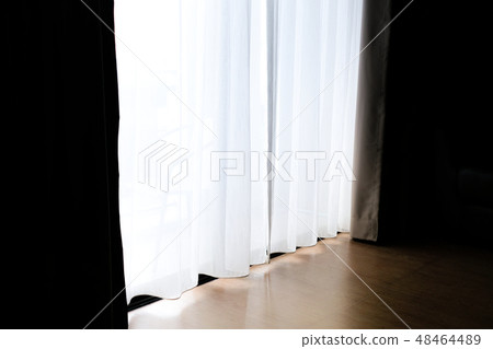 Dawn of light through a translucent white curtains Dawn of light through a translucent white curtains 48464489
