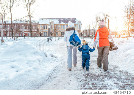 A young, seven woman mom with son 3-6 years old and girlfriend returning home after a sporting event A young, seven woman mom with son 3-6 years old and girlfriend returning home after a sporting event 48464710