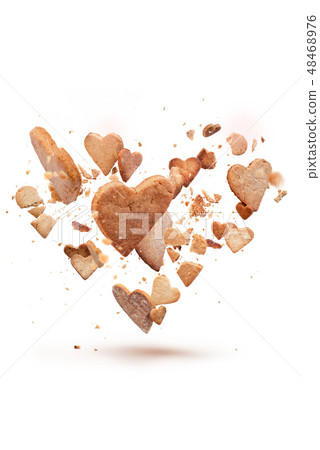 Card with flying crisp biscuit in shape of heart 48468976