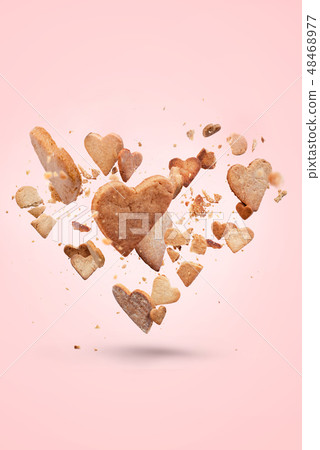 Card with flying crisp biscuit in shape of heart Card with flying crisp biscuit in shape of heart 48468977