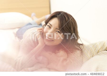 Young lady relaxing lifestyle holiday cheeks Young lady relaxing lifestyle holiday cheeks 48469812