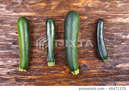 zucchini on a wooden background zucchini on a wooden background 48471378