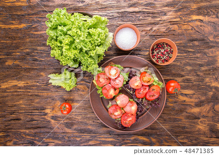 toasts with fresh tomato, top view 48471385