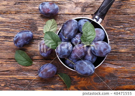 plums on the table plums on the table 48471555