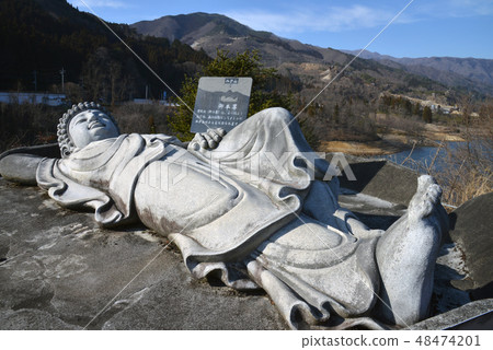 Replica of the Buddha Buddha on the shore lake side 48474201