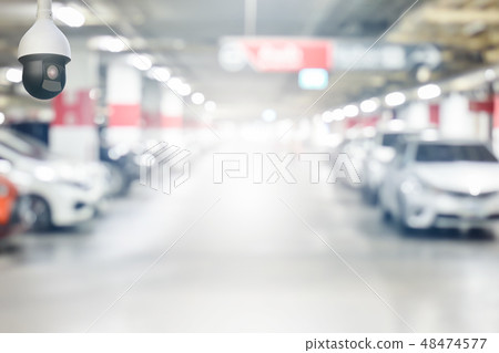 cctv security camera on blur underground cars parking garage with light on exit way use as cctv security camera on blur underground cars parking garage with light on exit way use as 48474577