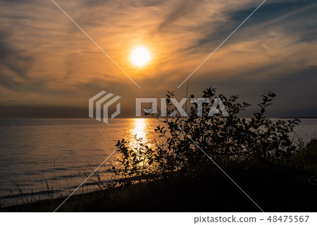 Sunset on the Baltic Sea coast in Nienhagen 48475567