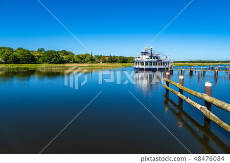 Landscape with pleasure boat in Prerow, Germany 48476084