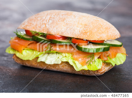 Fresh healthy salmon sandwich with lettuce  Fresh healthy salmon sandwich with lettuce  48477165
