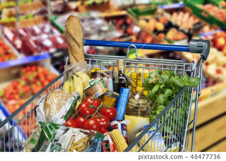 Shopping cart with foods in supermarket 48477736