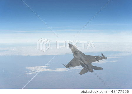 The F-16 aircraft flew through the atmosphere 48477966