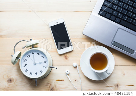 smart phone with tea cup and computer on wooden 48481194