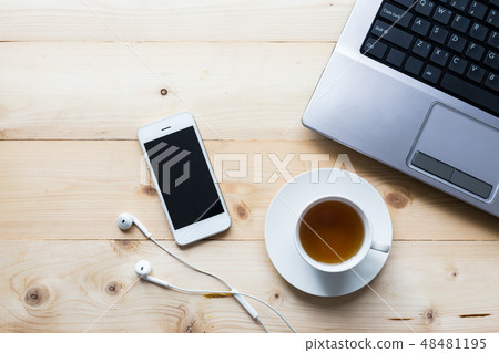 smart phone with tea cup and computer on wooden smart phone with tea cup and computer on wooden 48481195
