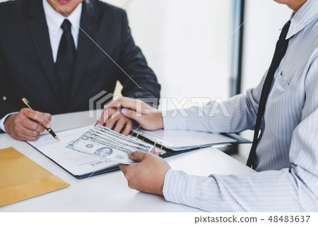Bribery and corruption concept, bribe in the form of dollar bill 48483637