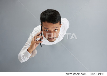 One asian man talk on smartphone One asian man talk on smartphone 48483998