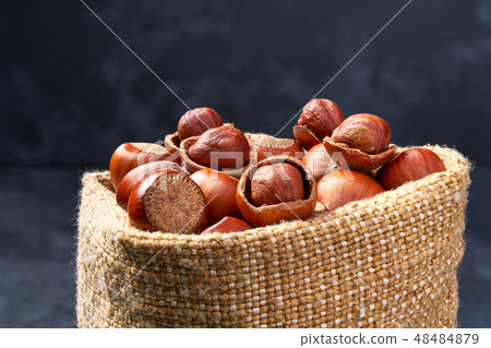 Hazelnut in a bag close-up. Organic hazelnut. Hazelnut in a bag close-up. Organic hazelnut. 48484879