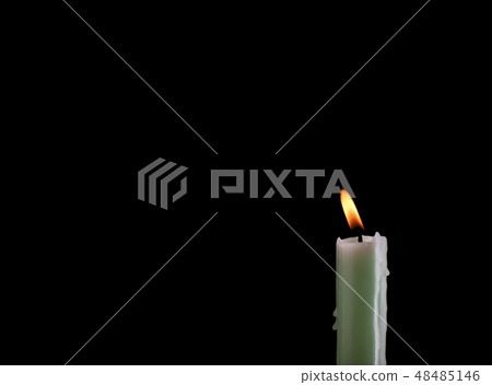 Burning pale green candle isolated Burning pale green candle isolated 48485146