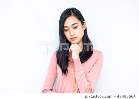 A woman who is troubled with a cheeks stick A woman who is troubled with a cheeks stick 48485664