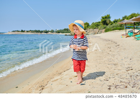 Toddler boy on beach Toddler boy on beach 48485670