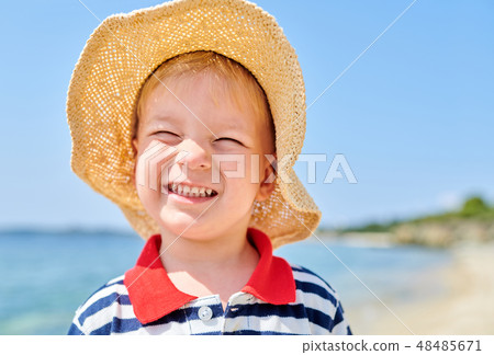 Toddler boy on beach Toddler boy on beach 48485671