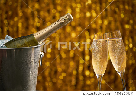 Glasses of champagne on a light background Glasses of champagne on a light background 48485797