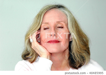 Mature female beauty expressions indoors. Mature female beauty expressions indoors. 48485995