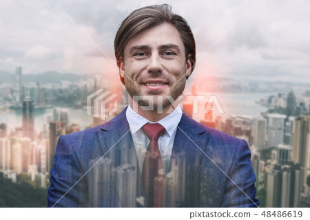 Always stay positive! Cheerful and handsome business expert smiling and looking at camera while Always stay positive! Cheerful and handsome business expert smiling and looking at camera while 48486619