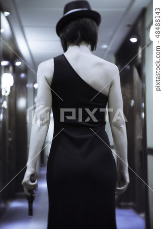 Lady with stylish wardrobe hat and gun Lady with stylish wardrobe hat and gun 48488143