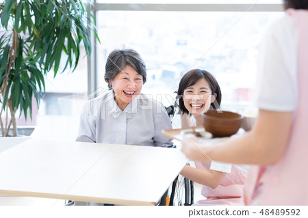 Caregiving image Senior women and caregivers diet 48489592