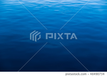 Water surface calm waves Blue gradation a Darker part Water surface calm waves Blue gradation a Darker part 48490734