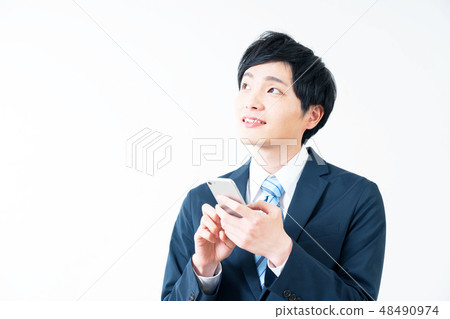 Businessman and smartphone 48490974