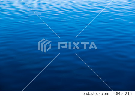 Water surface calm ripples blue gradation a weak wave 48491216
