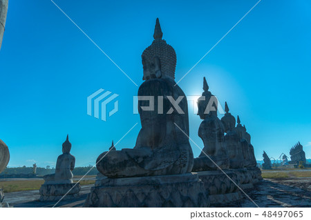a lot of big Buddha statues in blue sky 48497065