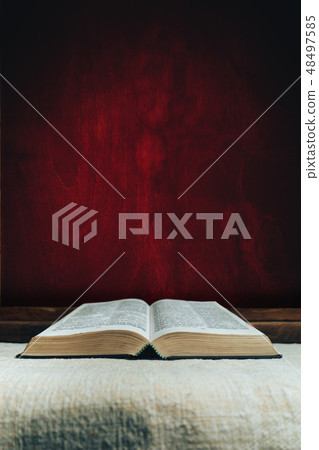 Open Holy Bible on a old table. Open Holy Bible on a old table. 48497585