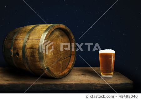 Wooden barrel and glass of beer Wooden barrel and glass of beer 48498040